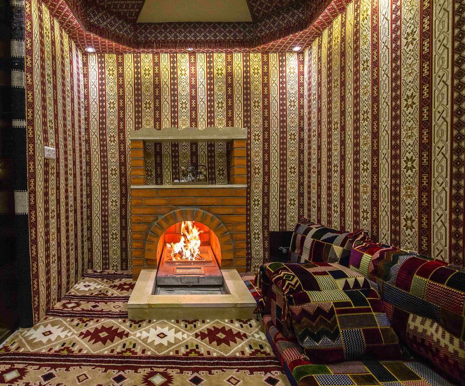 Rest Night Serviced Apartments- Alhamra 리야드 외부 사진 A majlis with a fireplace